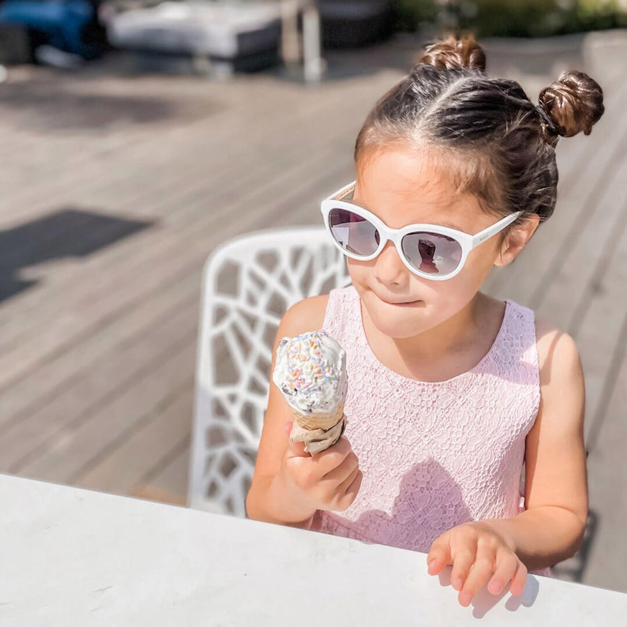 toucca kids youth polarized sunglasses girl wearing white sunglasses eating ice cream