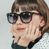 toucca kids tortoise kids polarized sunglasses - adorable girl posing while wearing tortoise sunglasses
